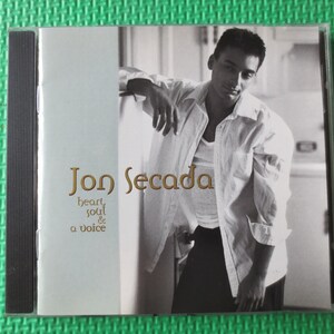 May include: A CD cover featuring Jon Secada, a singer, with the title "heart, soul & a voice" in gold lettering.