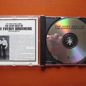 May include: A CD case with a silver CD inside. The front of the case features a black and white photo of the Everly Brothers. The text on the case reads "The Very Best of The Everly Brothers".