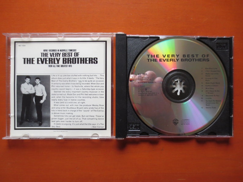 May include: A CD case with a silver CD inside. The front of the case features a black and white photo of the Everly Brothers. The text on the case reads "The Very Best of The Everly Brothers".
