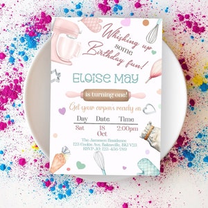May include: A pink and white birthday invitation with a watercolour illustration of kitchen tools and the text "Whisking up some birthday fun! Eloise May is turning one! Get your aprons ready on Sat 18 Oct 2:00pm The Jameson Residence 123 Cookie Ave, Bakesville, BKI V28 RSVP JO: 123-456-789"