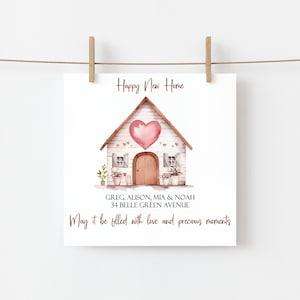 May include: A watercolor illustration of a white house with a pink heart on the front. The text "Happy New Home" is above the house and the text "GREG, ALISON, MIA & NOAH 34 BELLE GREEN AVENUE May it be filled with love and precious moments" is below the house.