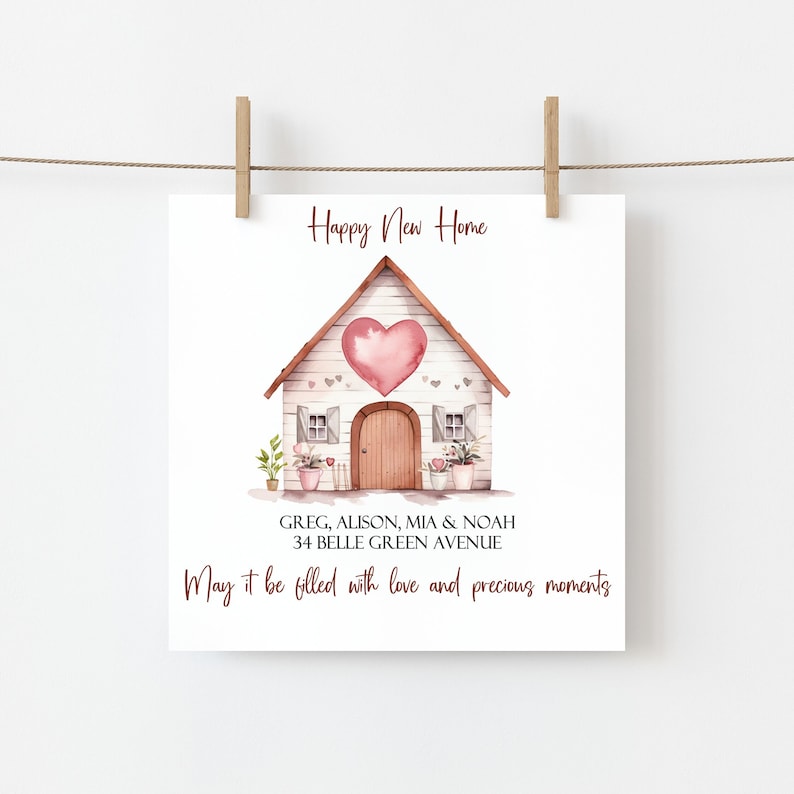 May include: A watercolor illustration of a white house with a pink heart on the front. The text "Happy New Home" is above the house and the text "GREG, ALISON, MIA & NOAH 34 BELLE GREEN AVENUE May it be filled with love and precious moments" is below the house.