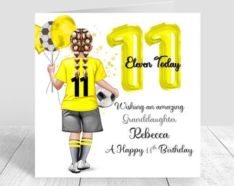 May include: A birthday card featuring a girl in a yellow soccer jersey with the number 11, holding a soccer ball and balloons. The card says "Eleven Today" and "A Happy 11th Birthday".