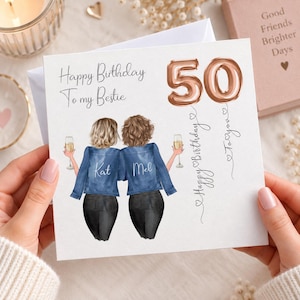 May include: A square greeting card featuring an illustration of two people with blonde and brown hair wearing denim jackets and black pants, holding champagne glasses. The text reads Happy Birthday To my Bestie, 50, and Happy Birthday To you.