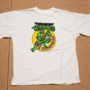 Vtg & rare TMNT Teenage Mutant Ninja Turtles Donatello 1990 Mirage Studios single stitch white t-shirt, sz women&#39;s Medium or Youth 12