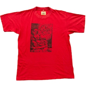 May include: Red short-sleeved t-shirt with a black and white graphic print of a band called "The Damned".