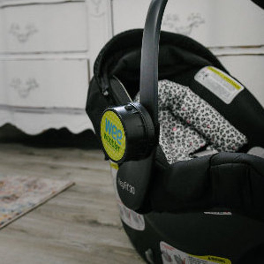 Vibrating Device or Attachment for Car Seats, Baby Carriers, and