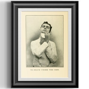 May include: A black and white photo of a man shaving under his chin. The photo is from an old book and has the text "TO SHAVE UNDER THE CHIN." printed below the image.