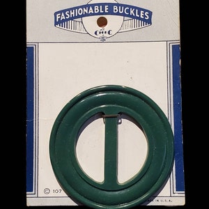 Vintage bakelite fashion buckle on original card