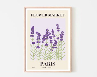 Puede incluir: Una impresión enmarcada con un fondo lila claro que presenta un grupo de flores de lavanda en tonos morados y verdes. El texto "FLOWER MARKET" está en la parte superior y "PARIS" en la parte inferior de la impresión.