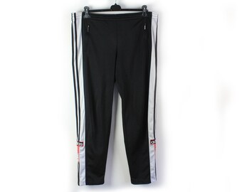 adidas originals mixed stripe popper pants in black and white