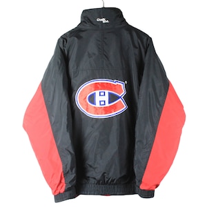 May include: A vintage black and red jacket with a Montreal Canadiens logo on the back. The logo is red, blue and white.