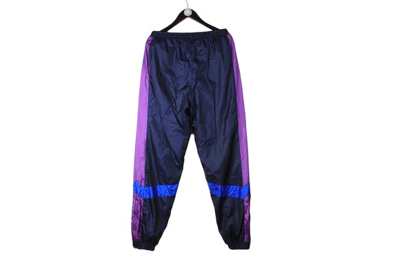 purple adidas track pants