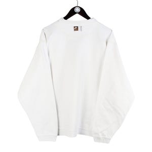May include: White long-sleeve sweatshirt with a small brown Nike logo on the back.