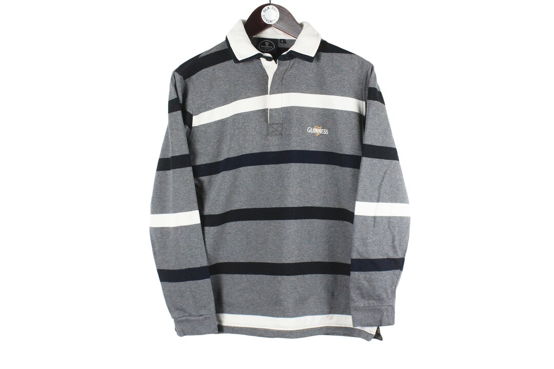Guinness Pewter/Cream Metal Badge L/S Rugby Shirt (S-XXXL) Guinness Pewter/Cream Metal Badge L/S Rugby Shirt (S-XXXL)
