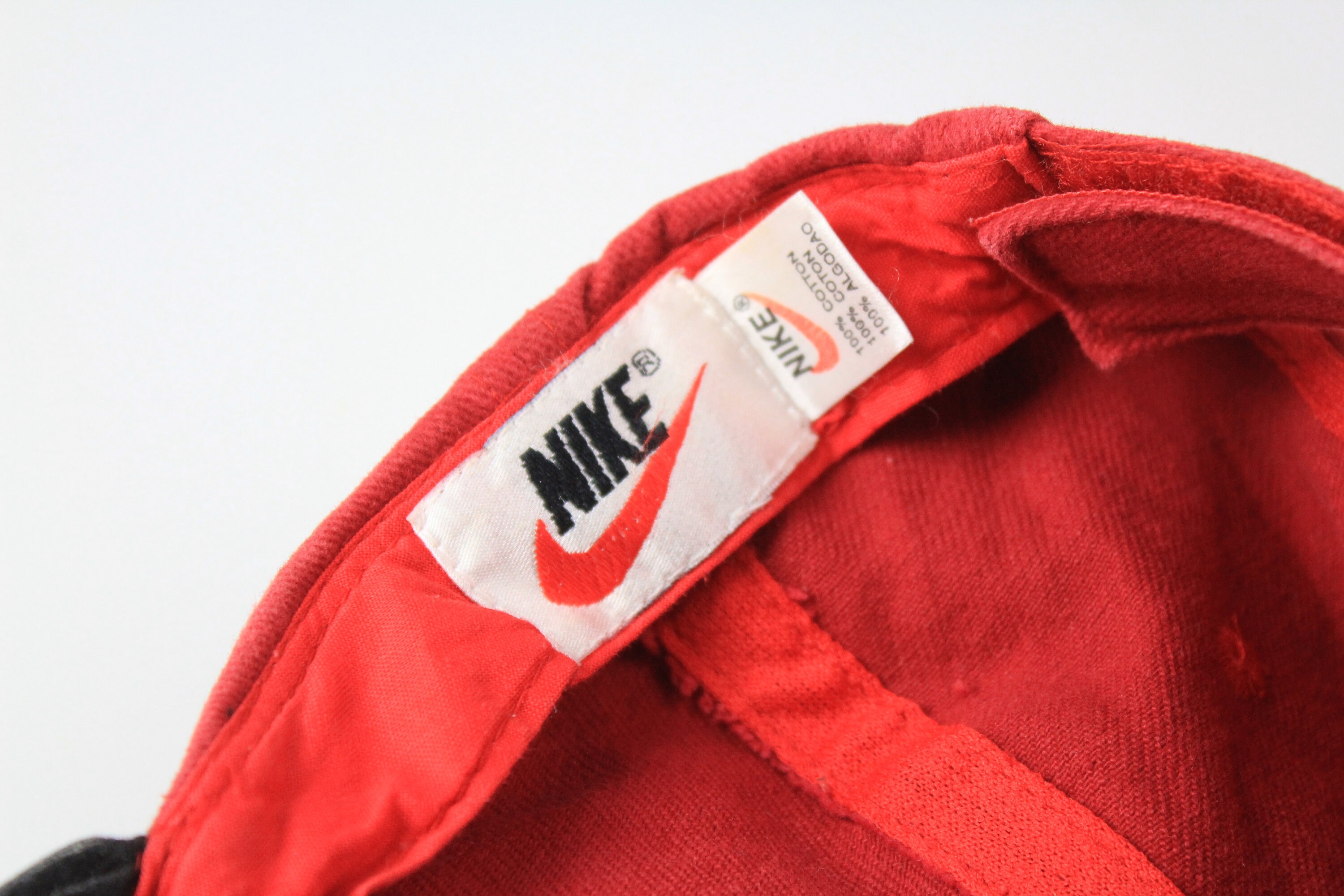 Nike red best sale and black hat