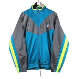 vintage PUMA Trainingsjacke Männer Größe XL authentische Retro Rave Style Sport 90er Jahre kleines Logo Windjacke athletisch Streetwear Bekleidung blau grau