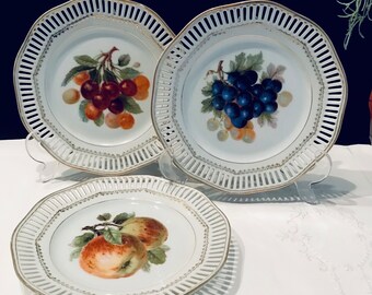 3 plates with openwork edge, inside with beautiful fruit design. Vintage porcelain plate fruit plate