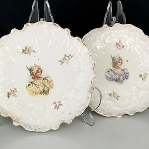 2 antique plates with floral women. Antique porcelain plates. Antique porcelain.