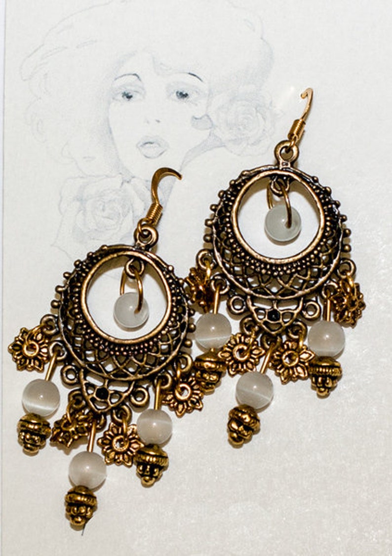 Earrings with opals and gold hooks image 1