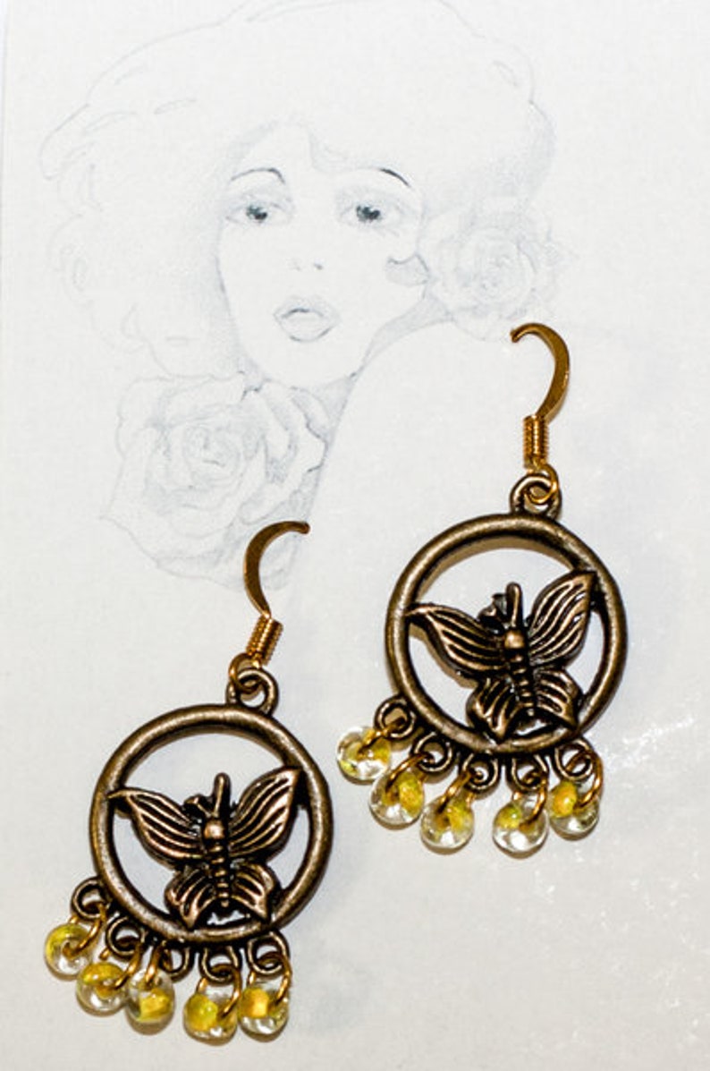 Earrings with glass beads and gold hooks image 1