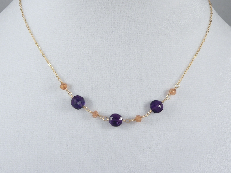 Delicate 24k gold necklace with Amethyst rounds and Peach Quartz accents.