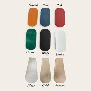 May include: Nine leather swatches in different colors: natural, blue, red, green, black, white, silver, gold, and bronze.