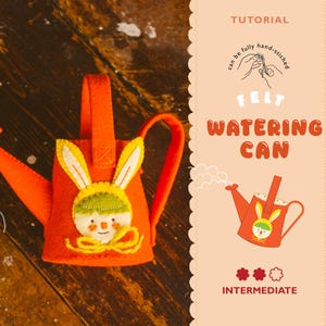 May include: An orange felt watering can with a bunny face design. The bunny has yellow ears, a green hat, and a yellow bow. The image also includes the text "FELT WATERING CAN" and "INTERMEDIATE".
