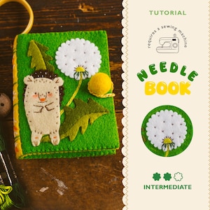 May include: A handmade green felt needle book with a hedgehog and dandelion design. The cover features a smiling hedgehog, a white dandelion, and a yellow ball. The text "NEEDLE BOOK" is displayed in green and yellow. The tutorial requires a sewing machine.