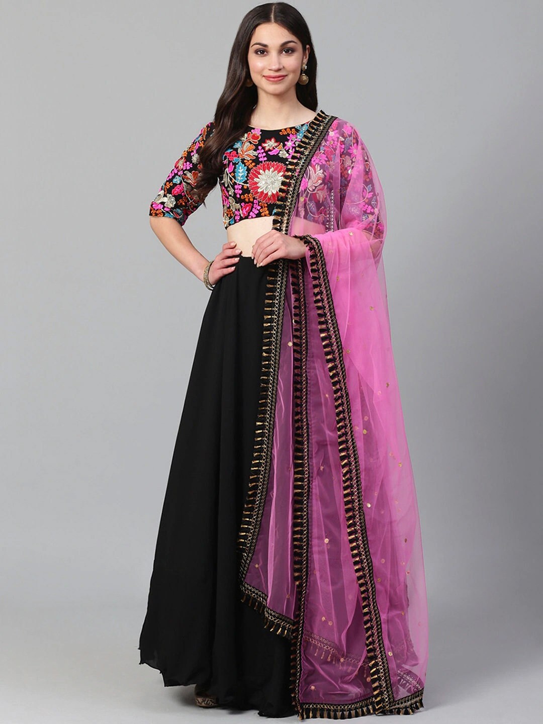 black blouse and pink lehenga