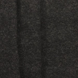 Könnte beinhalten: Nahaufnahme eines dunkelgrauen Stoffes mit einer flauschigen Textur.