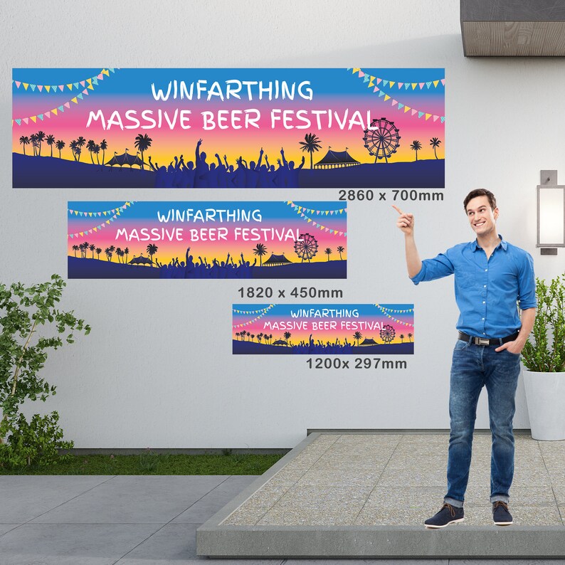 May include: Three banners with the text "WINFARTHING MASSIVE BEER FESTIVAL" in white, against a colorful sunset background. The banners vary in size: 2860 x 700mm, 1820 x 450mm, and 1200 x 297mm. A man in a blue shirt and jeans points at the banners.