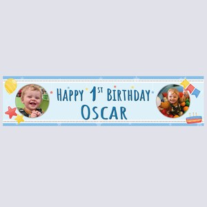 May include: A light blue banner with the text "Happy 1st Birthday Oscar" in dark blue. The banner includes two circular photo frames with a child's image, along with star and balloon illustrations. A cake illustration is also present.