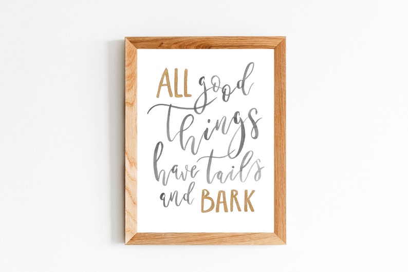 May include: A framed print with the text "ALL good things have tails and BARK" in gold and gray calligraphy.
