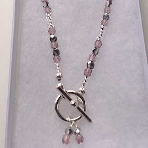 Dusky pink and silver Preciosa crystal toggle clasp necklace. With black card gift box.