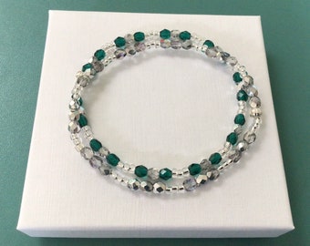 Pair of emerald green and silver Preciosa crystal bracelets with a white card gift box