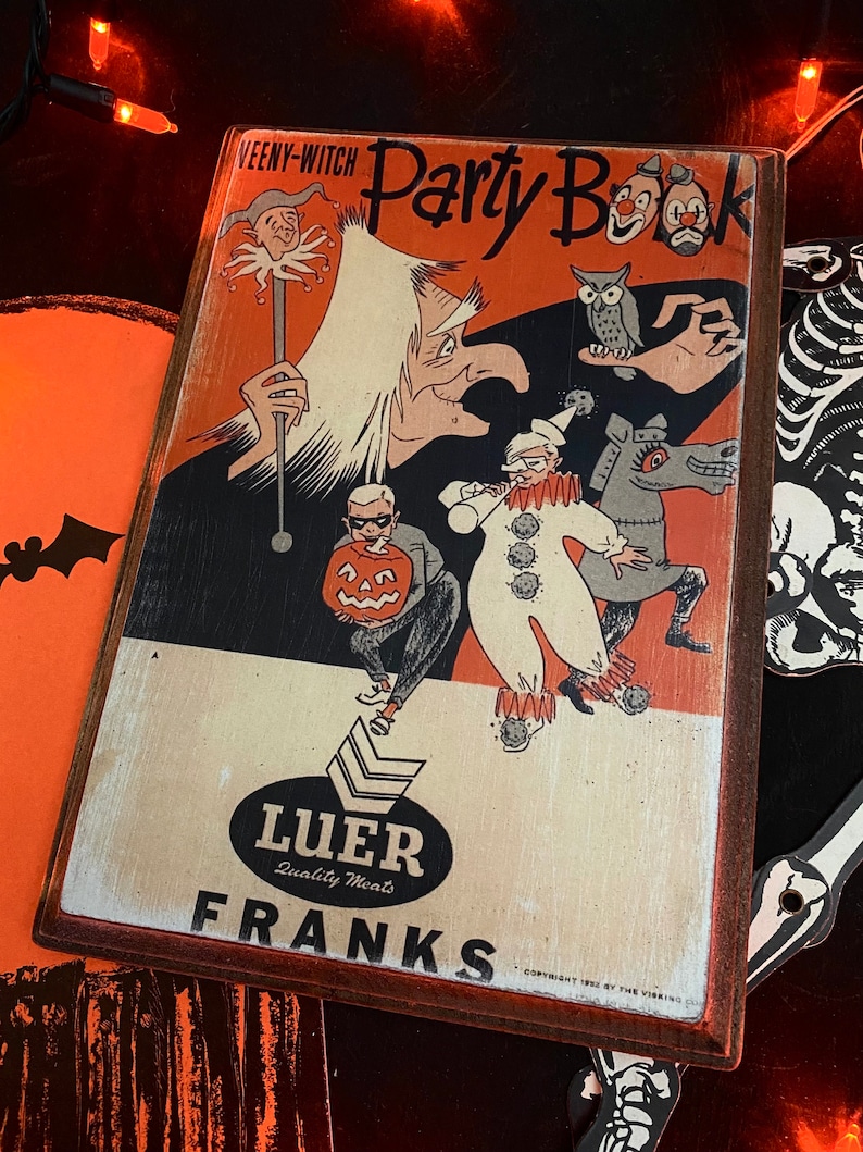 May include: A vintage Halloween party book cover with a witch, a clown, a jack-o-lantern, and an owl. The cover is orange and black with the text "WEENY-WITCH Party Book" and "Luer Quality Meats Franks".