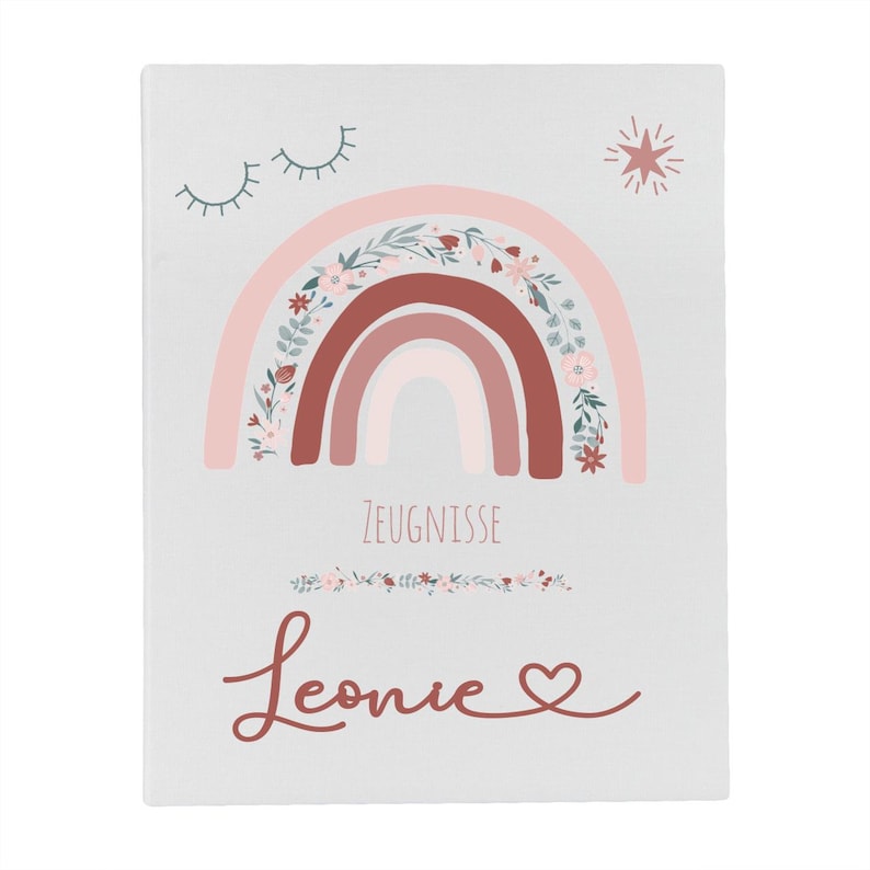 May include: A white rectangular folder featuring a printed design of a rainbow with floral accents, a star, and closed eyes. The text ZEUGNISSE is printed in the center, with the name Leonie and a heart symbol written in cursive below it.