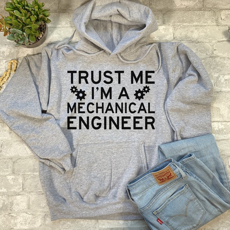 May include: Gray hooded sweatshirt with the text "TRUST ME I'M A MECHANICAL ENGINEER" and two gear symbols.