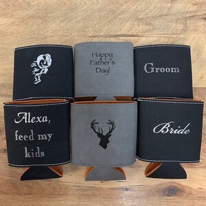 May include: Six different personalized can coolers. The coolers are made of black and gray faux leather. The text on the coolers includes "Happy Father's Day!", "Groom", "Bride", "Alexa, feed my kids", and a deer silhouette.