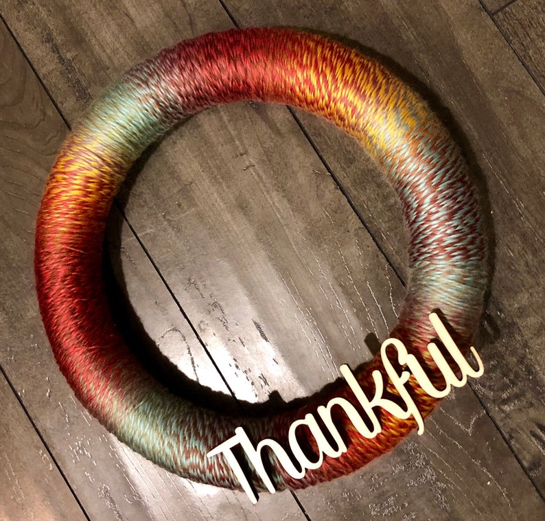 Super cute and fully customizable varied color yarn wreath Perfect for farmhouse decor and for year round decorating!