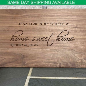May include: A wooden chopping board with the text "home sweet home" and the coordinates "41° 52′ 41.20″ N 87° 37′ 47.27" W" engraved on it. The names "Kendra & Jimmy" are also engraved on the board.