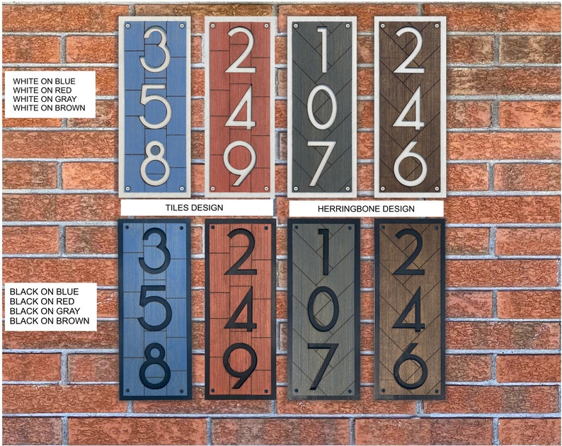 May include: Two sets of house numbers, 107, 246, and 358, in white on blue, red, gray, and brown backgrounds. The numbers are in a tile design and a herringbone design.