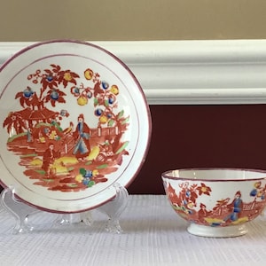Antique Staffordshire Porcelain Teacup and Saucer with Oriental Scene and Pink Lustre, 19th Century