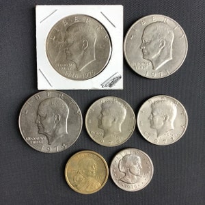 Lot Of 7 American Coins: 5 X Dollar And 2 Half Dollars