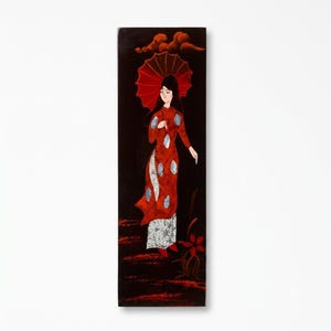 May include: A rectangular black lacquer wall panel featuring a painted figure in a long red dress with blue accents, holding a red umbrella. The figure stands above red ground textures with stylized clouds above and a red flower at the bottom.