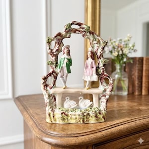 May include: A set of three ceramic mugs with a speckled, matte finish. The mugs are in shades of cream, light gray, and dark gray. Each mug has a simple, minimalist design, perfect for coffee or tea.