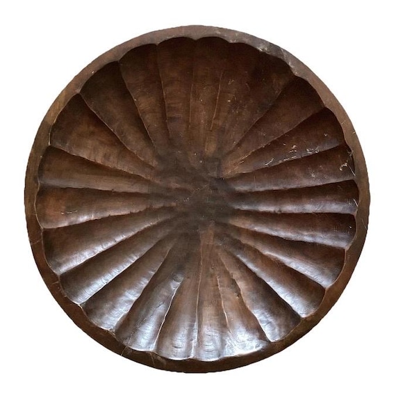 A genuinely massive 27-inch, 36-pound hand-carved wooden bowl that doubles as a sculptural room centerpiece — this thing commands a table.