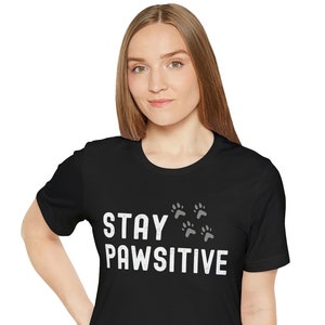 Stay Pawsitive Dog Paw Print Shirt, Cat Paw Print Shirt, Dog Lover T-shirt, Cat Lover T-shirt, Pawsitive Vibes, Funny Pet Motivation Quote image 1