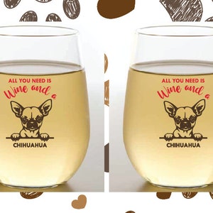 May include: Two clear wine glasses with the text "All you need is Wine and a Chihuahua" printed on them. The glasses are filled with a light yellow liquid.